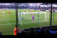 a soccer game is being played on the field