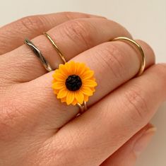 "Adjustable Sunflower Ring Sunflower Jewelry -I make this ring using an silver finish adjustable ring base and an orange resin sunflower cabochon -sunflower measures 5/8\" across -adjustable -nickel and lead free -Gift Boxed More of my Sunflower Jewelry Here: https://www.etsy.com/shop/lydiasvintage/items?search_query=sunflower More of my Jewelry: lydiasvintage.etsy.com" Adjustable Sunflower Design Flower Ring Gift, Adjustable Sunflower Design Flower Ring, Adjustable Yellow Flower Ring For Gift, Nickel Free Adjustable Round Flower Ring, Nickel-free Adjustable Round Flower Ring, Adjustable Nickel Free Flower Ring, Adjustable Nickel-free Flower Ring, Fall Jewelry Inspiration, Resin Sunflower