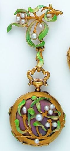 An Art Nouveau gold, pearl and enamel lapel watch, Swiss, circa 1900. Decorated with mistletoes in green enamel and pearl berries. With Swiss assay mark. #ArtNouveau #watch Gold Tungsten Wedding Bands, Bijoux Art Nouveau, Mens Gold Wedding Band