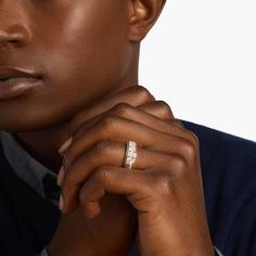 a close up of a person wearing a ring