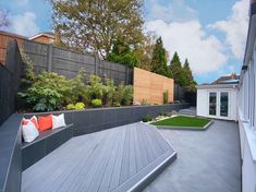 an outdoor patio area with seating and landscaping