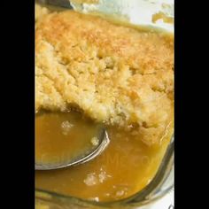 a close up of a spoon in a dish with some food on top of it