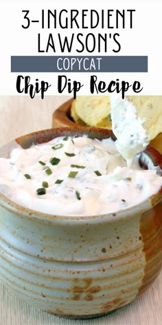 a bowl filled with dip and chips on top of a table