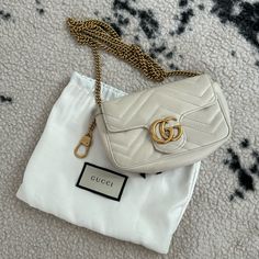 Gently Worn With Some Discoloration Inside. Comes With Dust Bag Gucci Super Mini Bag, Gucci White Bag With Removable Pouch, White Gucci Bag With Removable Pouch, Formal Gucci Bag With Gold-tone Hardware, Gucci Super Mini, Gucci Shoulder Bag With Gold-tone Hardware And Double Handle, Gucci Shoulder Bag With Gold-tone Hardware In Coated Canvas, Gucci Bag, Mini Bag