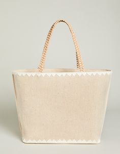 The best party is a beach party and our Fiesta Tote is always ready to come along! Decorated with palm beach embroidery on a cotton and jute blend, this tote features a fun, tiered tassel fob and a faux leather bottom base to keep it dry. The custom patterned cotton interior features 2 slip pockets and 1 hanging zipper pocket. Bohemian Canvas Beach Bag For Summer, Cotton Straw Tote Bag With Braided Handles, Beach Bags With Leather Handles In Cotton, Beach Bags With Leather Handles And Cotton Material, Cotton Beach Bag With Braided Handles For Travel, Cream Cotton Bag For Vacation, Spring Canvas Beach Bag, Bohemian Canvas Beach Bag, Cotton Beach Bag For Vacation