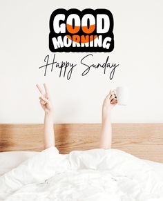 a person laying in bed with their feet up and the words good morning happy sunday above them