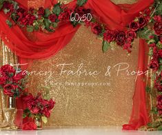 red flowers and greenery on a gold backdrop for a wedding photo shoot in las vegas, nv