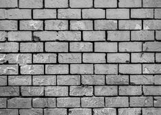 a black and white photo of a brick wall with no mortars or mortars