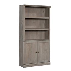 a gray bookcase with two doors and drawers on the bottom, one door open