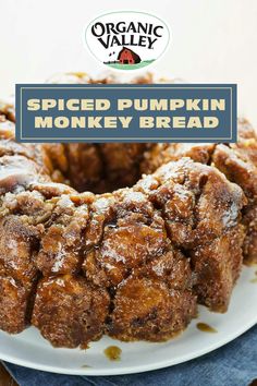 a spiced pumpkin monkey bread on a white plate with the title overlay reads, organic valley