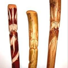 three different types of carved wooden canes