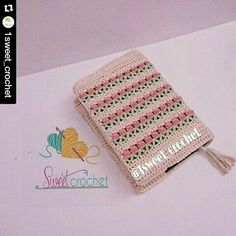 a crocheted book with a tassel on it