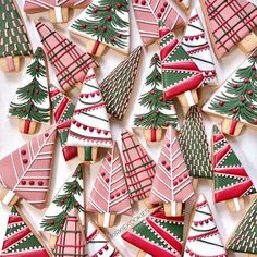 cookies decorated with christmas trees and stockings on them