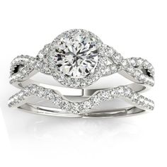 a white gold ring set with diamonds on it