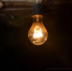 a light bulb is hanging from a wire