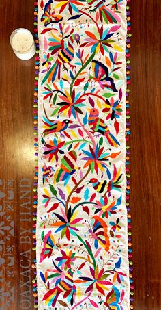 a table runner with colorful designs on it