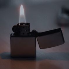 a lighter is lit up on a table