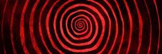 an abstract red and black background with spirals in the center, which is made up of