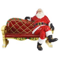 a santa clause sitting on a bench with his feet propped against the sleigh