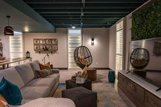 a living room filled with furniture and a flat screen tv