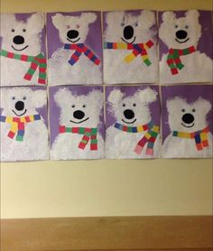 four polar bear paintings are displayed on the wall in front of a window with purple background