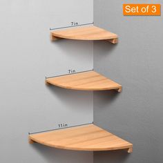 three wooden shelving shelves are shown with measurements for each shelf on the wall and below them