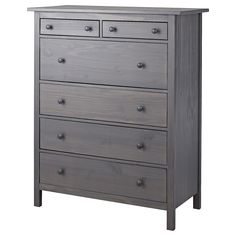 the chest of drawers is made from wood and has five drawers, one with two doors on