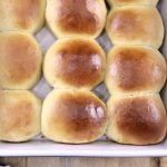 several rolls in a baking pan on a table