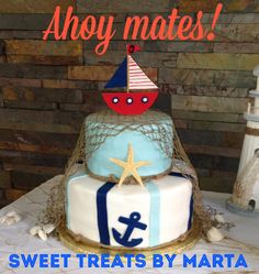 there is a birthday cake with an anchor and boat on the top that says, ahoy mates sweet treats by marta