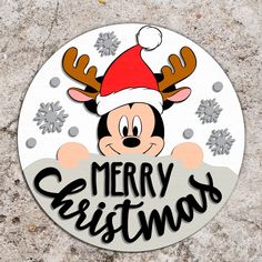 a mickey mouse christmas ornament on the ground