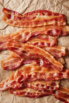 bacon strips are laid out on brown paper