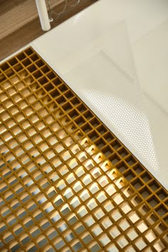 a white table topped with lots of yellow squares