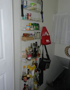 the pantry is organized and ready to be used as a storage rack for food, drinks, and other items