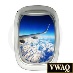 an airplane window with the view of snow covered mountains