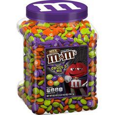 m & m's halloween candy mix in a plastic jar with purple lid and gummy