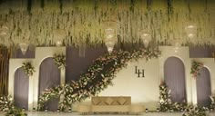 an elegant wedding setup with flowers and greenery