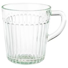 a clear glass mug with wavy lines on the bottom