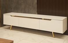 a large white cabinet sitting on top of a tiled floor