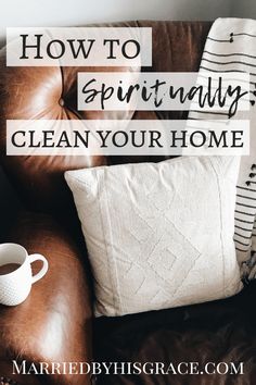 a couch with pillows and a coffee mug on it that says how to spiritfully clean your home