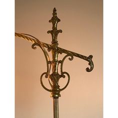 an ornate metal lamp on a table