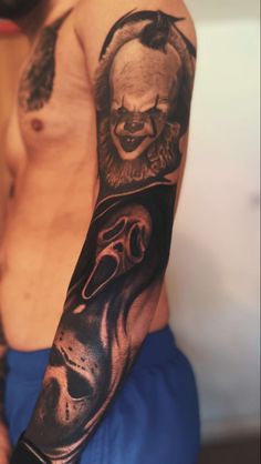 a man with a tattoo on his arm has a skull and clown face tattooed on it