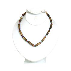 Simple and elegant, this Set of 6 Bamboo Choker Necklaces makes an elegant and authentically African addition to any ensemble. The chocker-style necklaces are made of oblong bamboo beads that have striated brown and tan patterns and are connected by round beads of various sizes and colors. With a set of six bamboo choker necklaces, you can wear one and share the others. Get them all today! Made in Kenya Bamboo Beads, Tuareg People, Ankh Necklace, Maasai, African Jewelry, Trade Beads, African Wedding, Choker Necklaces, Wedding Necklace