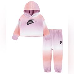 Get The Full Nike Look In This Unique Printed Club Hoodie Joggers Set. Featuring A Cool Pullover Hoodie And Fleece Jogger Pants, Both In Gradient All-Over Print, This Outfit Definitely Is A Statement. Set Includes - 1 Hoodie And 1 Joggers Soft, Light Weight Fleece Imported Nike Logo At Chest Ribbed Cuffs Stretch To Hold In Warmth Size & Fit Jogger Pants With An Elastic Waistband And Cuffs For Comfy Fit Regular Fit For An Easy Feel Material & Care Machine Washable Cotton, Polyester Nike Cotton Sportswear Sets, Pink Cotton Hooded Sets, Hooded Pink Cotton Sets, Nike Long Sleeve Loungewear Sets, Nike Loungewear Sets, Purple Cotton Playwear Sets, Nike Loungewear Sets For Winter, Nike Winter Loungewear Sets, Nike Cotton Sets For Winter