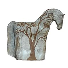 a horse statue with a tree painted on it