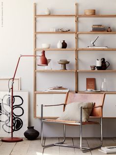 a living room filled with furniture and shelves