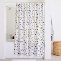 a bathroom with a bathtub, shower curtain and rug