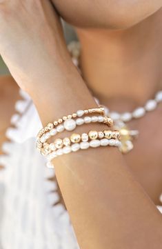 Stack on the shine with this party-ready bracelet set illuminated by cultured freshwater pearls and 18-karat gold-plated beads. Set includes four bracelets Pearl size: 4-6mm Cultured freshwater pearl/18k-gold plate Imported Pearl Bracelet With Spacer Beads, Festive Gold Pearl Bracelets, Festive Gold Pearl Bracelet, White Pearl Bracelets For Festive Occasions, Festive White Pearl Bracelets, Pearl Bracelets With Spacer Beads, White Stackable Pearl Bracelet, Stackable White Pearl Bracelet, Gold Pearl Beaded Bracelets