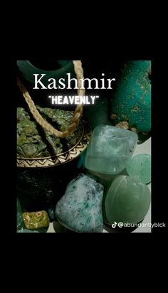 the cover of kashminr's heavenly book, featuring green and blue rocks