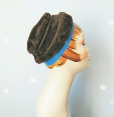 This casual ladies hat from the 1940s comes from a specialty shop within Bloomingale's that concentrated on interpreting the "mode" of each season for the American consumer.  This little hat is made of plush fur felt, has a folded shape and a bow on the back.  The inner hat band measures 20.25"   Please note: the blue band appearing in my photos is not part of the hat, it's part of the paint work on the mannequin. Thank you for looking! #10838 Little Hat, Plush Hat, Blue Band, Hat Band, Hats For Women, Felt, Paint, Band, Hats