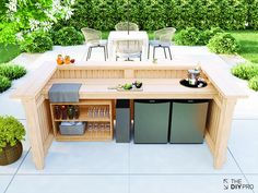 an outdoor kitchen is built into the side of a patio with chairs and tables around it